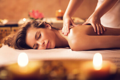 Young woman relaxing during back massage at the spa.